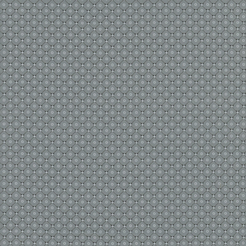 Gray fabric featuring a lattice design with small rings in the middle of each.