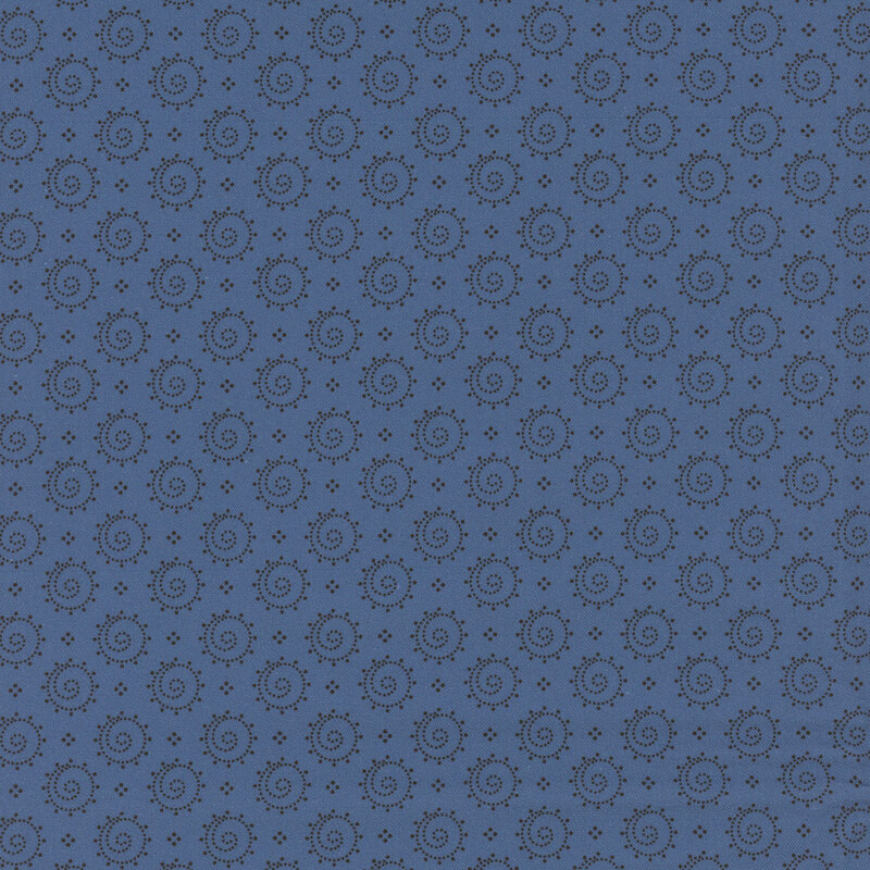 Blue fabric with a design of dotted circles with swirling centers.