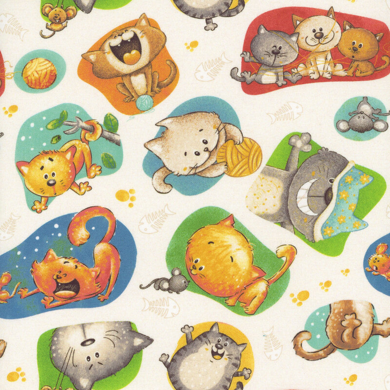 Off-white fabric with blobs of color featuring various scenes of cats playing.