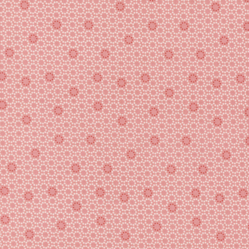 Light pink background with scattered white dots and small red flower-like patterns.
