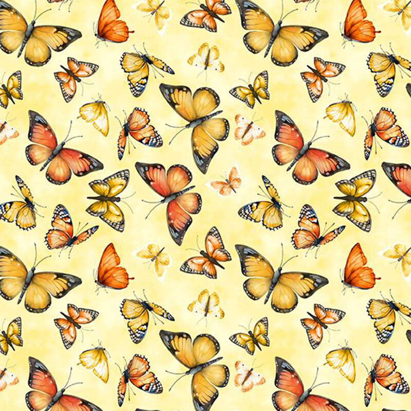 Yellow fabric with fluttering yellow and orange butterflies.