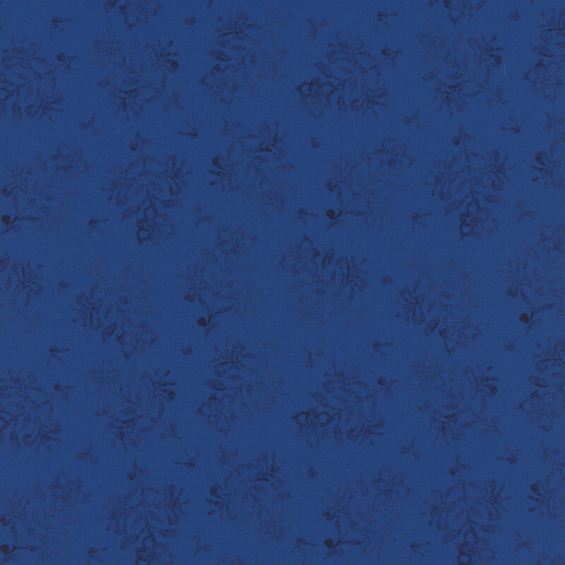 Dark blue fabric featuring a pattern of floral designs.