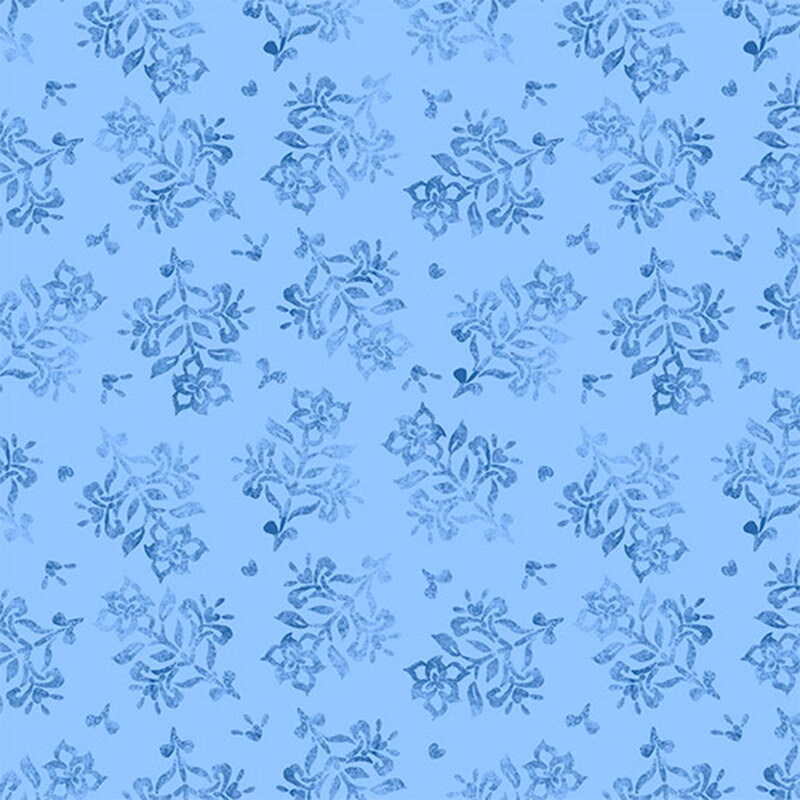 Light blue fabric featuring a pattern of floral designs.