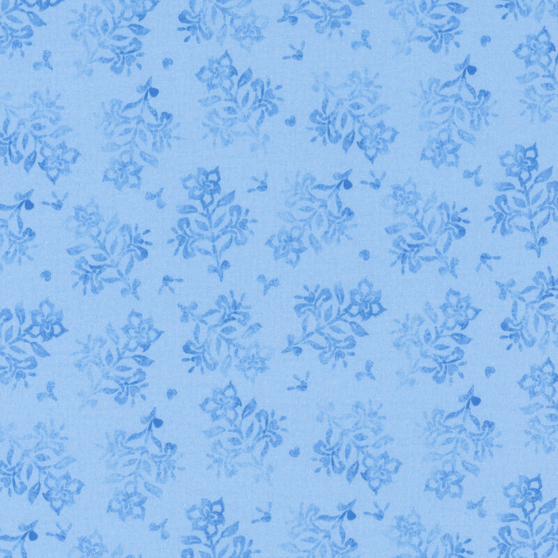 Light blue fabric featuring a pattern of floral designs.