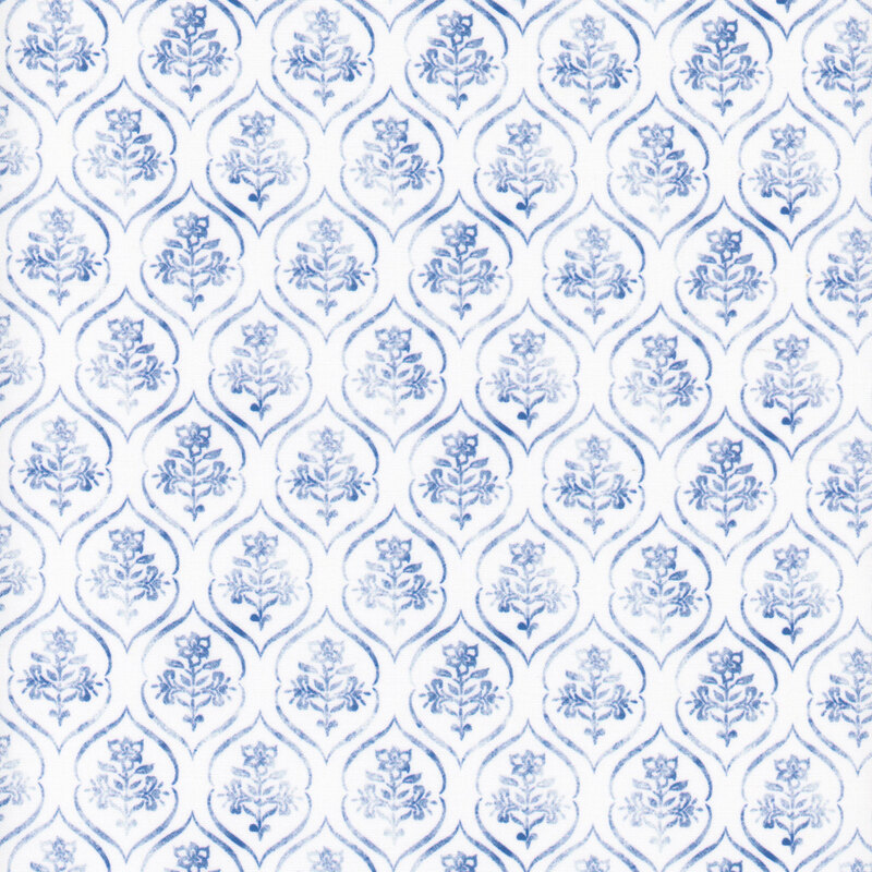 White fabric with a blue ornamental floral design.