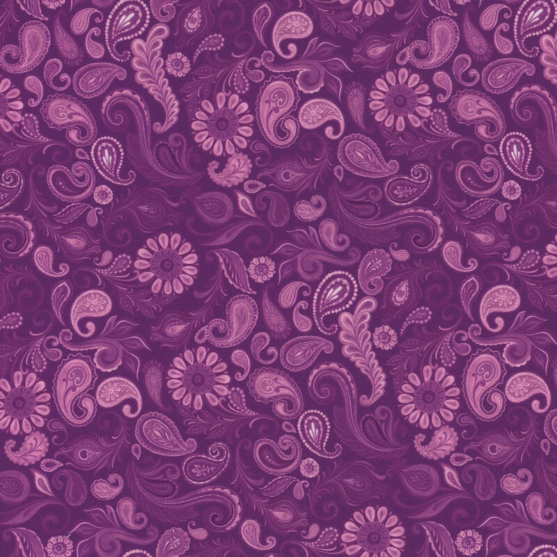 Purple patterned fabric featuring intricate swirls, paisleys, and flowers in varying shades