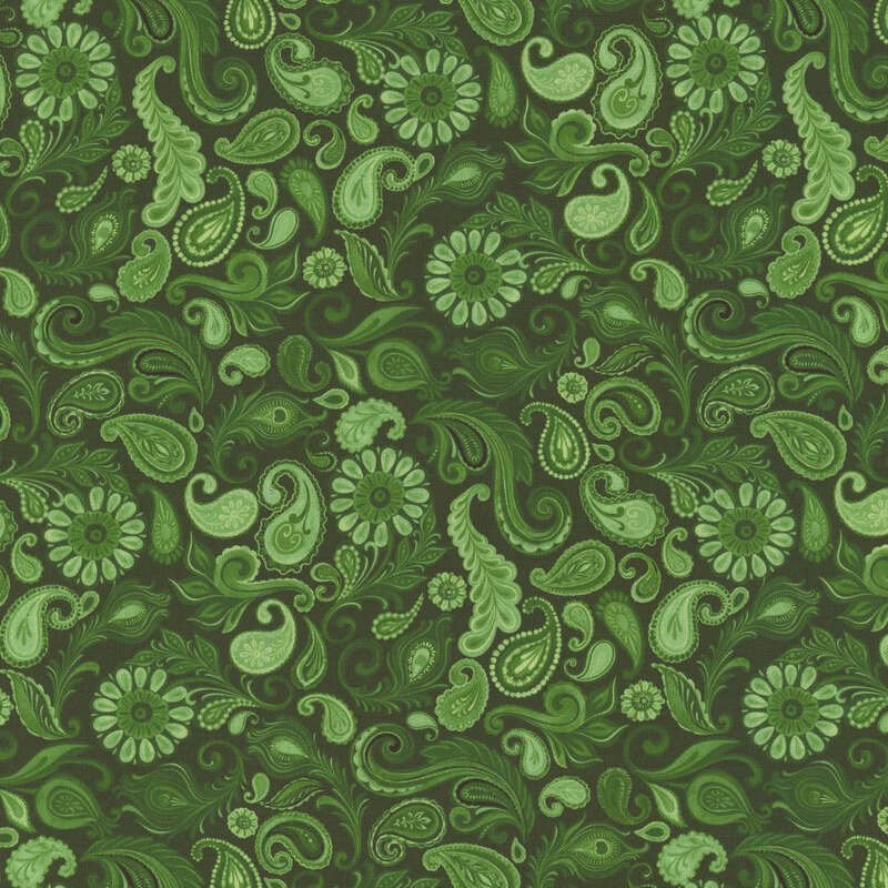 Green patterned fabric featuring intricate swirls, paisleys, and flowers in varying shades