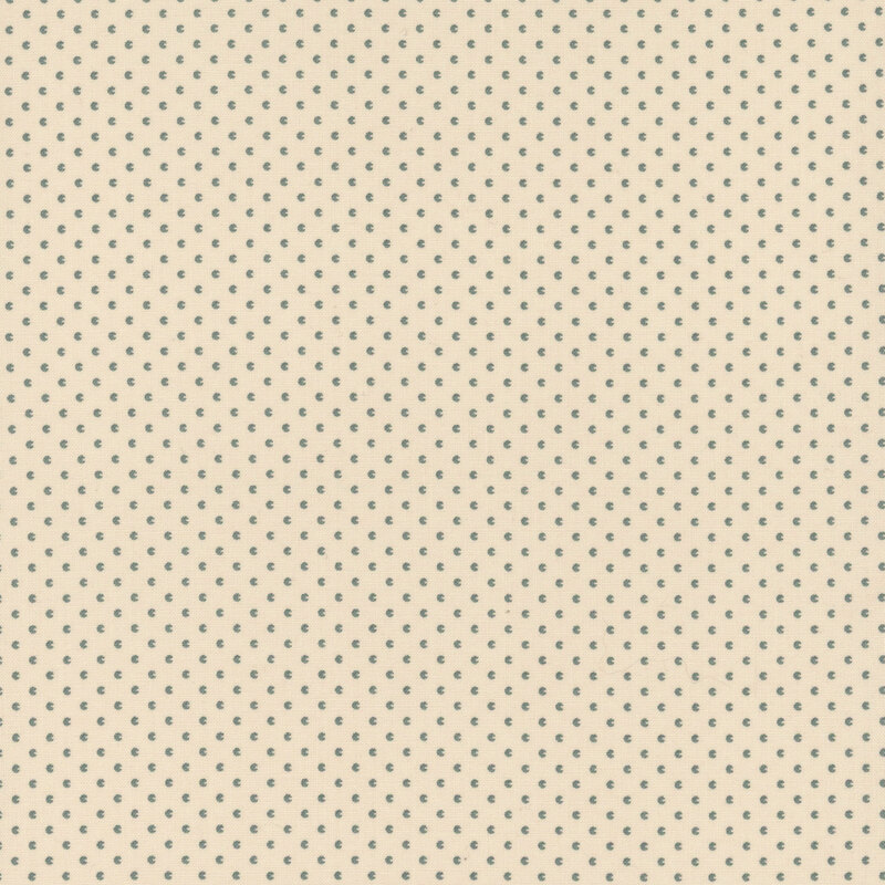 Cream fabric with tiny, blue textured shapes.