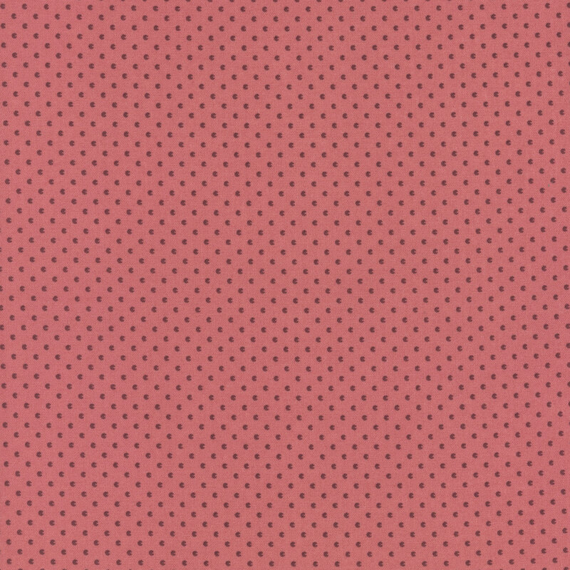 Berry pink fabric with tiny, abstract seed shapes.