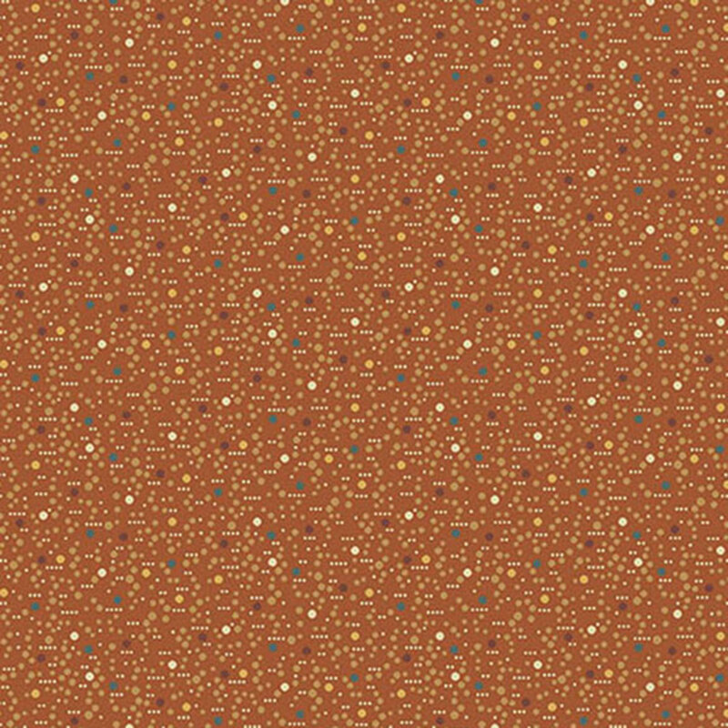 Burnt orange fabric with textured lines and multicolored dots.
