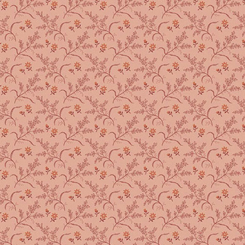 Coral pink fabric with tonal leafy branches and small orange flowers.