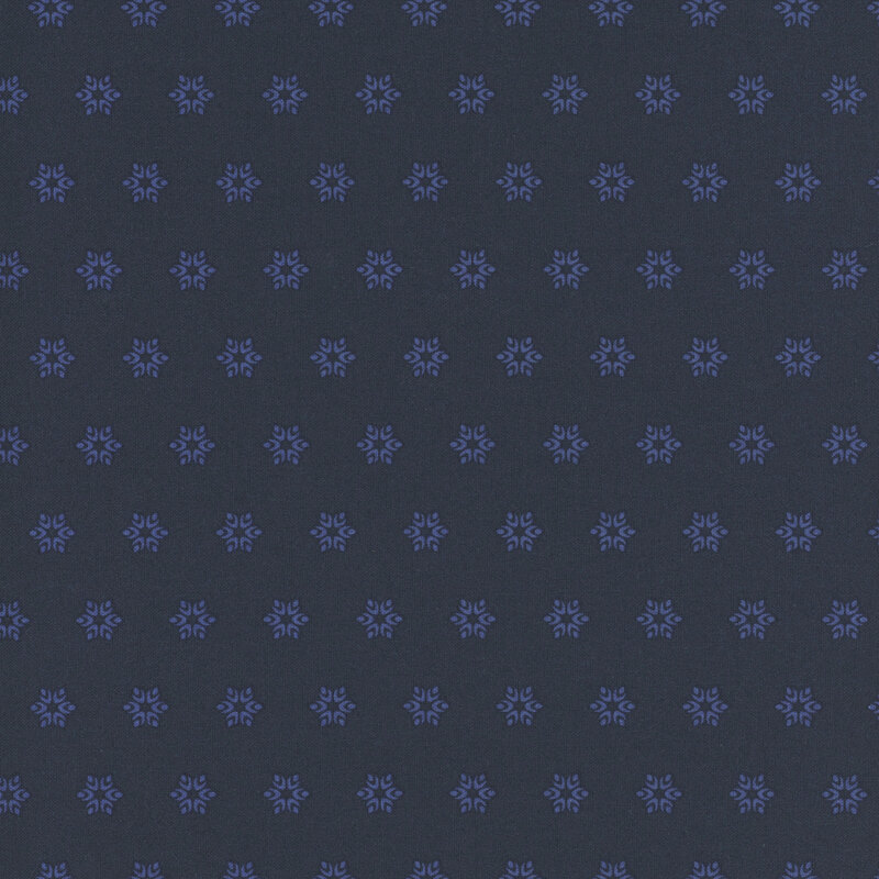 A dark blue fabric with tonal cornflower blue starbursts.