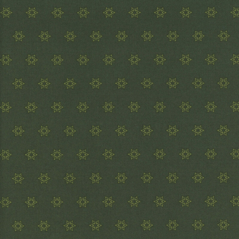An olive green fabric with tonal sage green starbursts.
