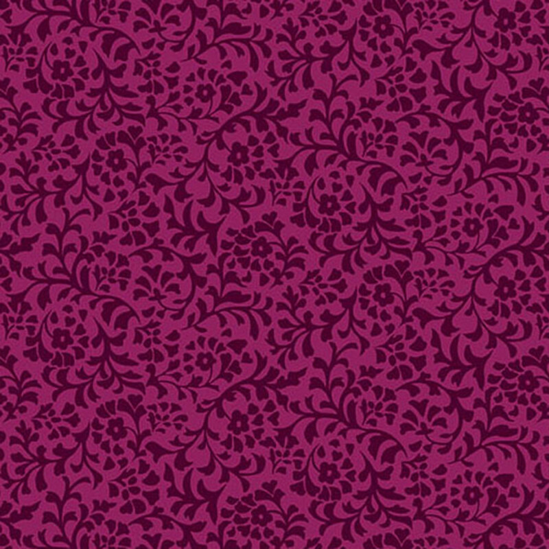 A magenta fabric with a dense pattern of tonal flower and leaf silhouettes.
