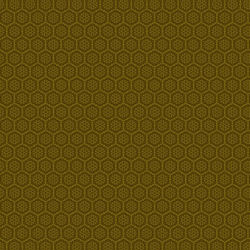 A brassy gold fabric with a tonal pattern of tiled geometric emblems.