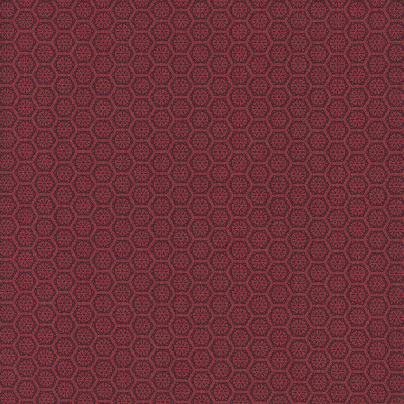 A mahogany fabric with a tonal pattern of tiled geometric emblems.