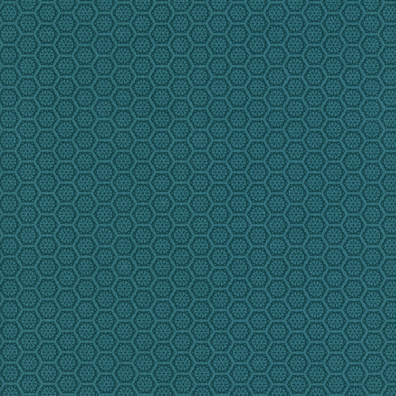 A teal blue fabric with a tonal pattern of tiled geometric emblems.