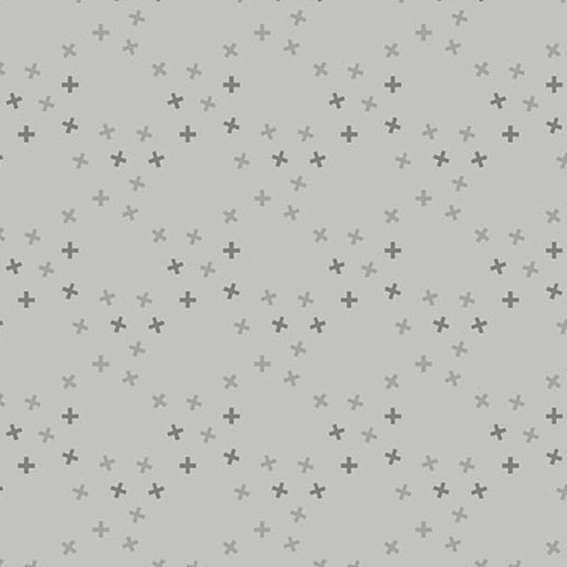 A smoke gray fabric with tossed tonal x's in a large lattice pattern.