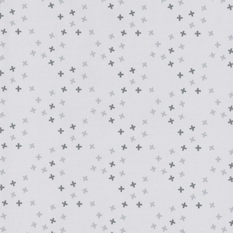 A smoke gray fabric with tossed tonal x's in a large lattice pattern.