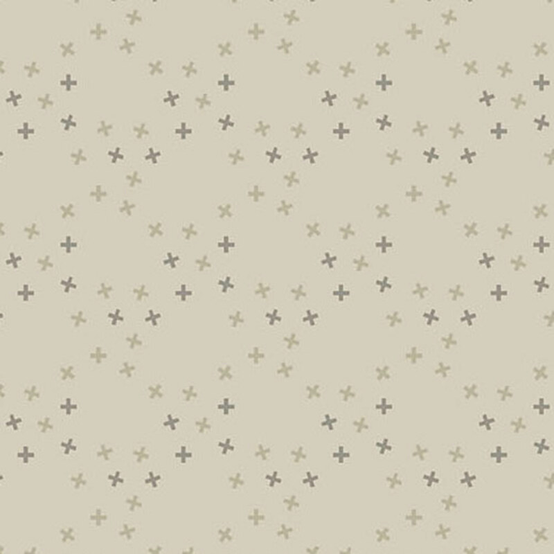 A taupe fabric with tossed tonal x's in a large lattice pattern.