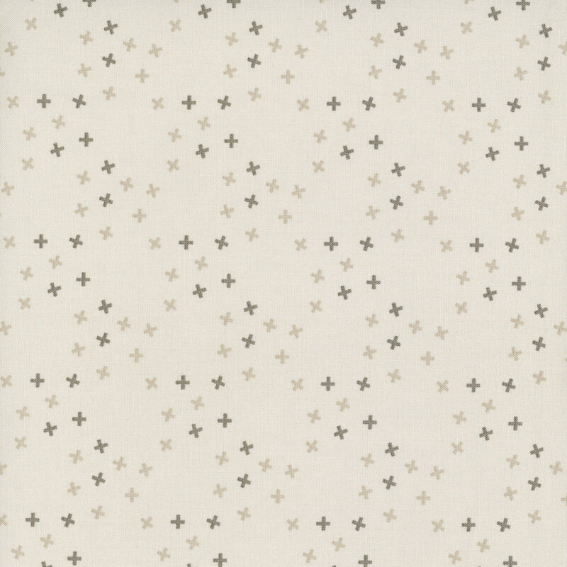 A taupe fabric with tossed tonal x's in a large lattice pattern.