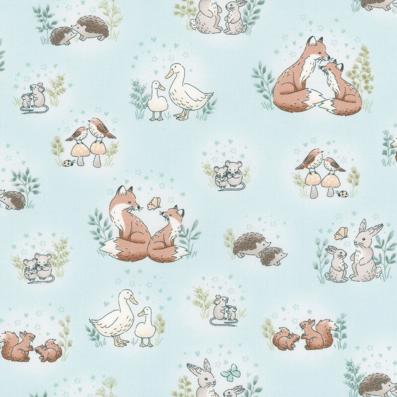 light blue fabric featuring various cute animals like foxes, rabbits, ducks, and hedgehogs.