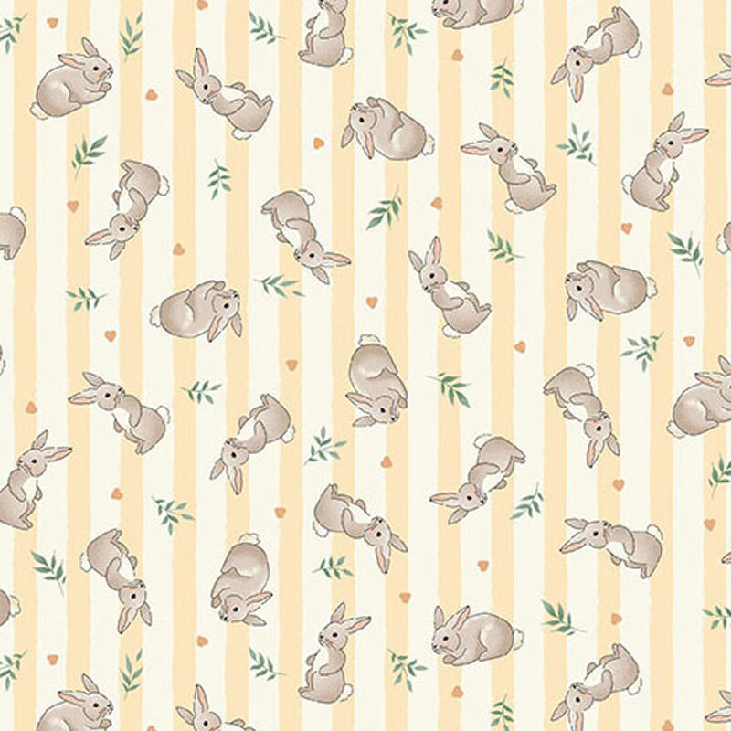 Fabric featuring gray rabbits and green leaves on a light yellow and cream striped background.