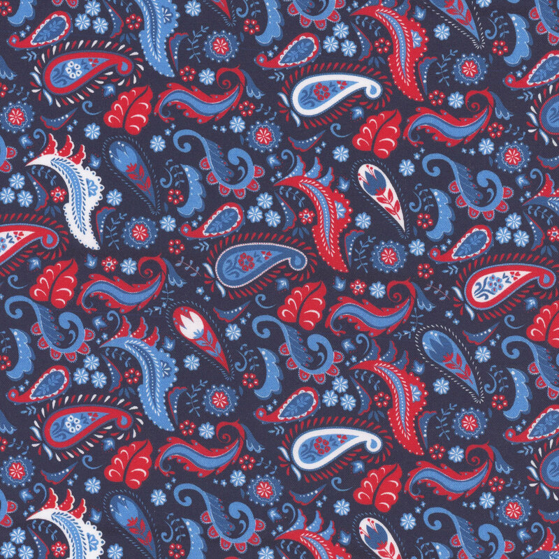 Seamless pattern featuring paisley shapes in red, blue, and white on a navy fabric.