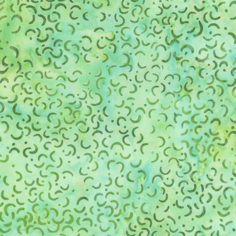 Mottled spring green batik swatch with dark green macaroni shapes and scattered dots.