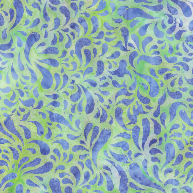 Mottled spring green and teal batik swatch with elongated indigo raindrop shapes.