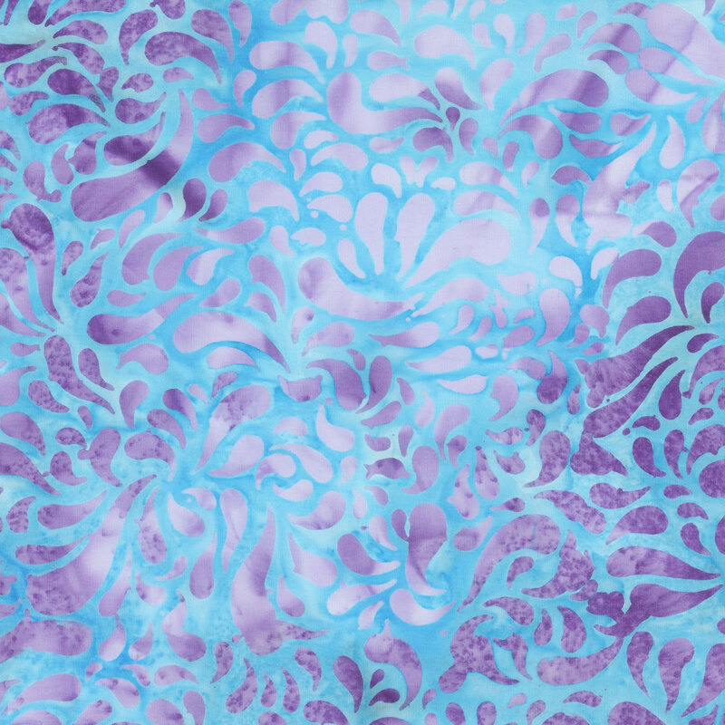 Mottled periwinkle blue batik swatch with elongated pruple raindrop shapes.