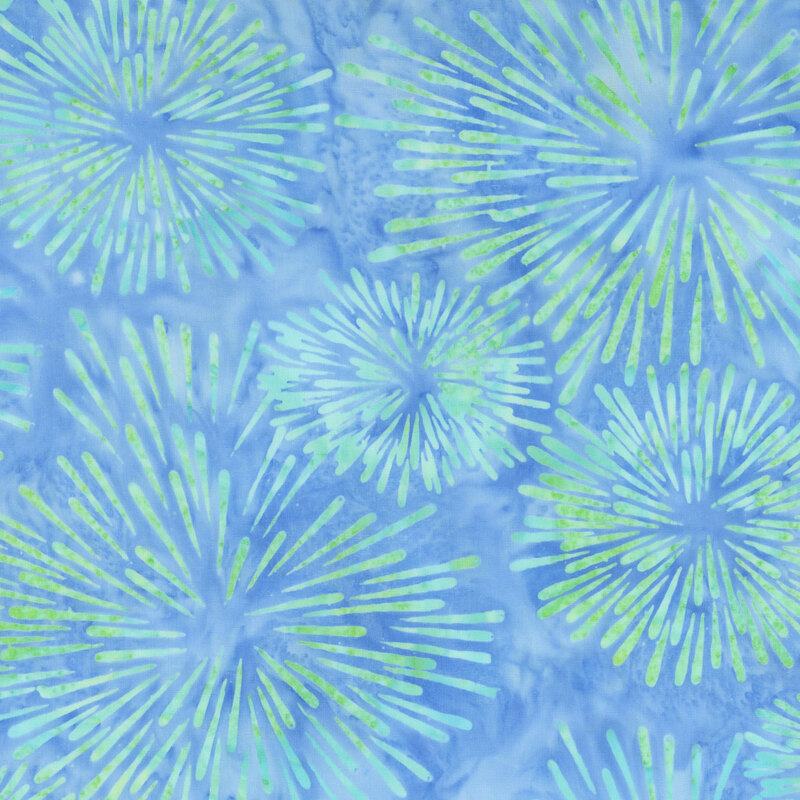 Mottled denim blue batik swatch with spring green firework starbursts.