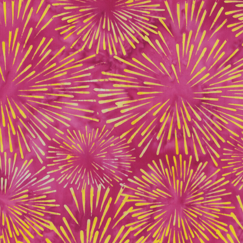 A vibrant pink fabric featuring yellow starburst patterns in various sizes.
