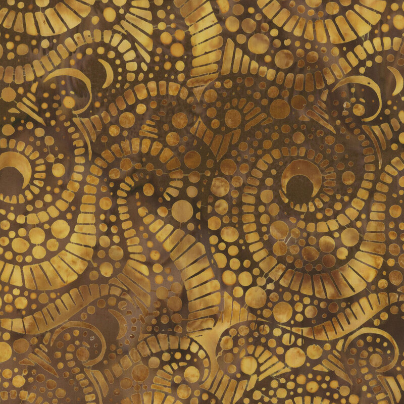 Abstract fabric of swirling shapes and dotted designs in earthy brown and gold tones.