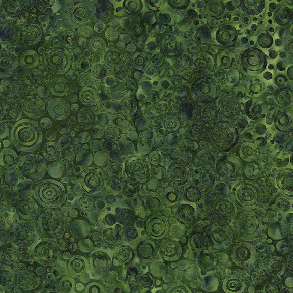 Green abstract fabric featuring numerous overlapping circles of varying sizes and shades.
