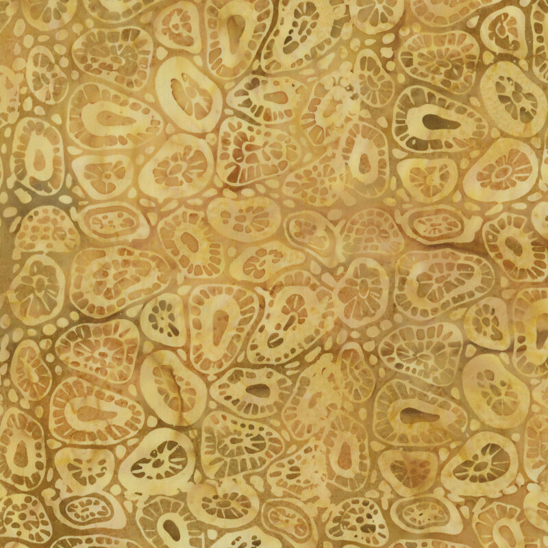 Abstract fabric pattern of varied shapes and textures in warm golden hues.