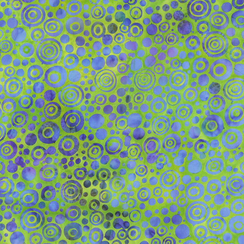 Abstract design featuring a pattern of overlapping blue and green circles of various sizes.