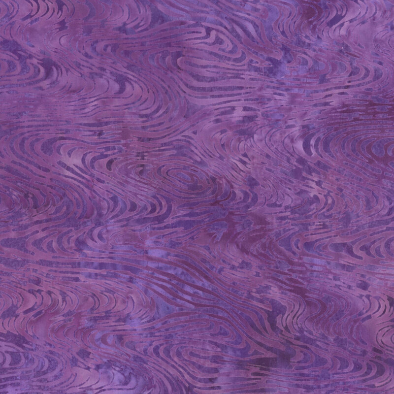 Abstract purple fabric pattern with swirling textures and shades.