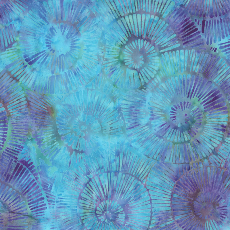 Abstract pattern of spiraling forms in shades of blue and green with a textured appearance.