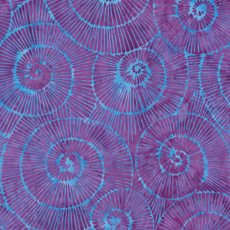 Pattern of overlapping purple and turquoise spiral shells on a textured background.