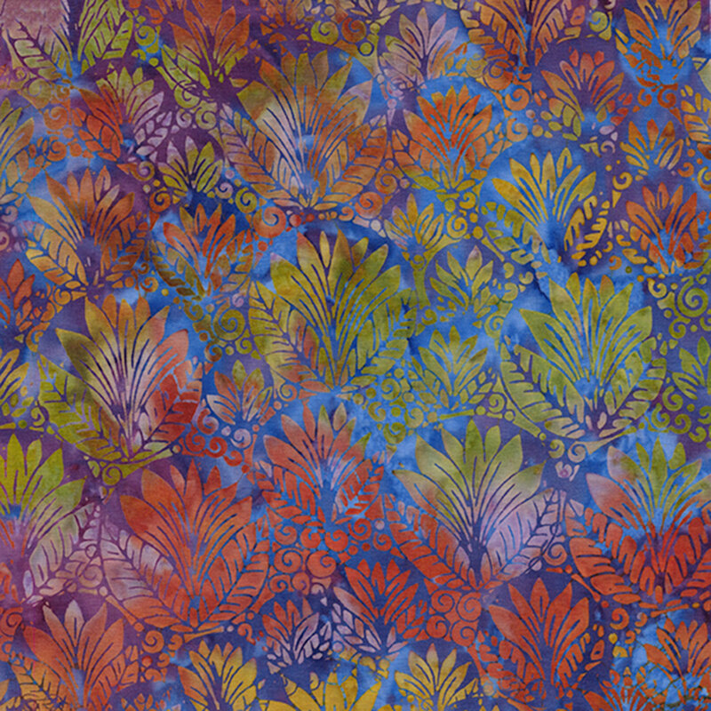 Mottled blue batik fabric with an ornamental, overlapping design of circular shapes filled with leaves and swirls in orange, green, yellow, and pink.