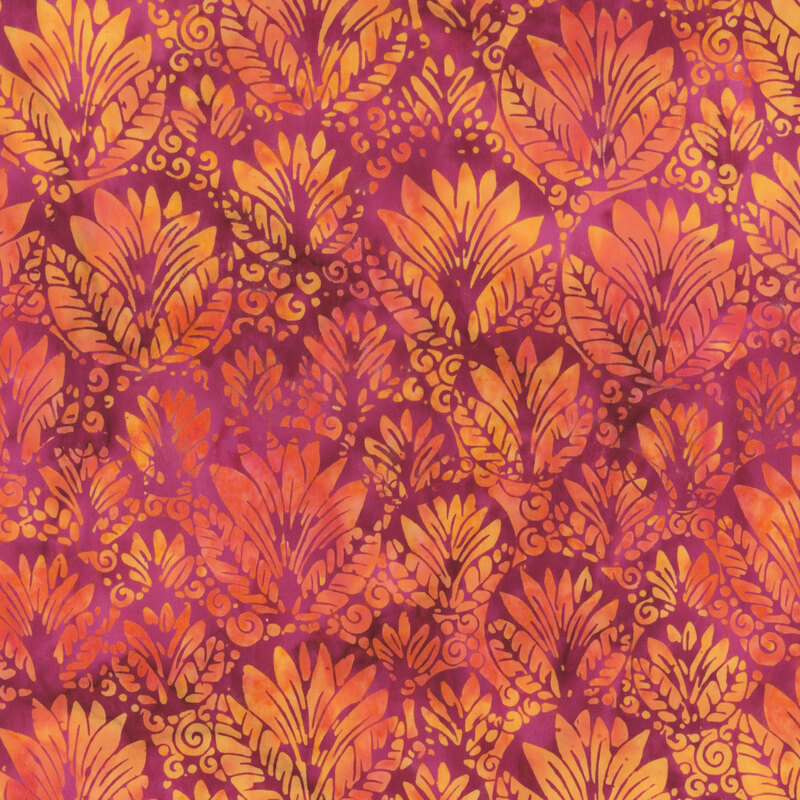 Mottled red batik fabric with an ornamental, overlapping design of circular shapes filled with leaves and swirls in orange, yellow, and pink.