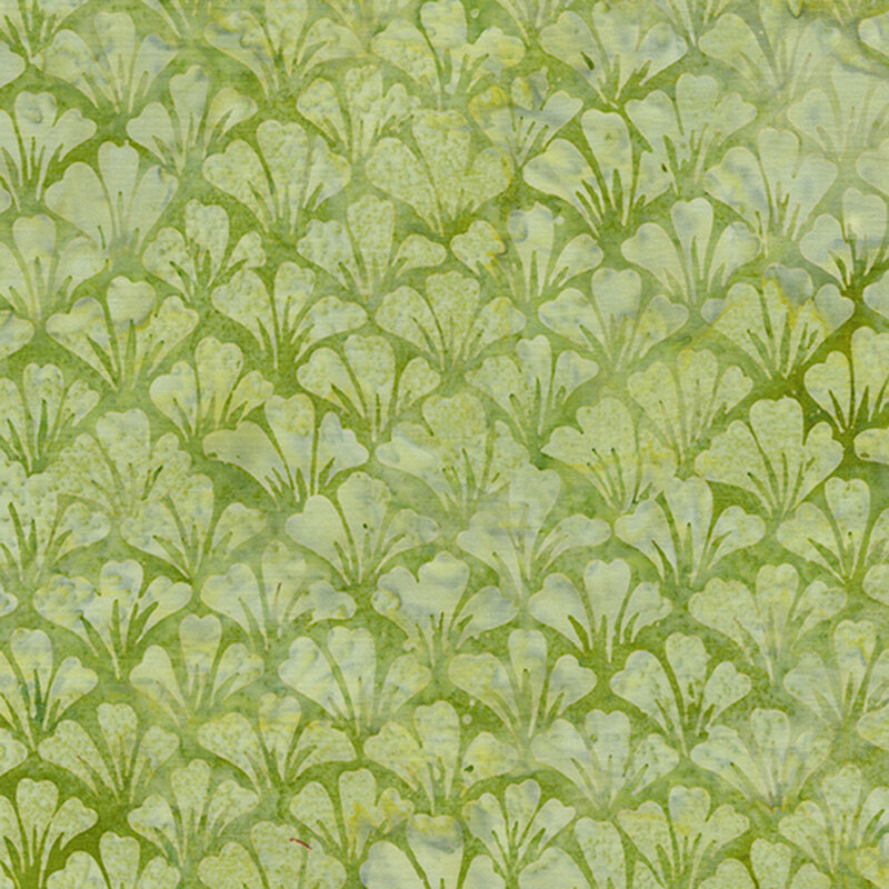 Mottled green batik fabric with overlapping rows of fanned out tonal flower petals.