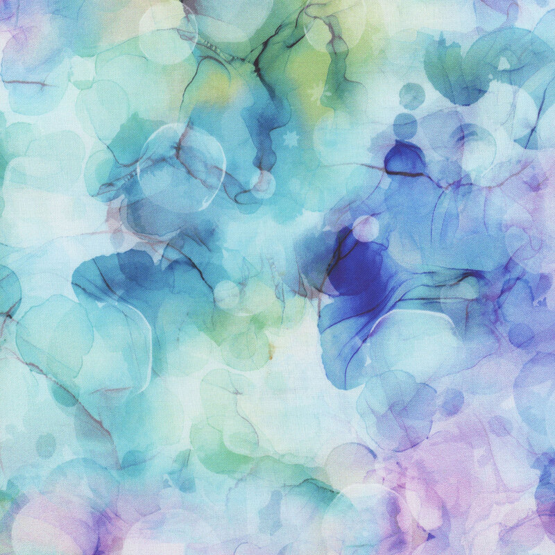 Purple and aqua watercolor on white fabric.