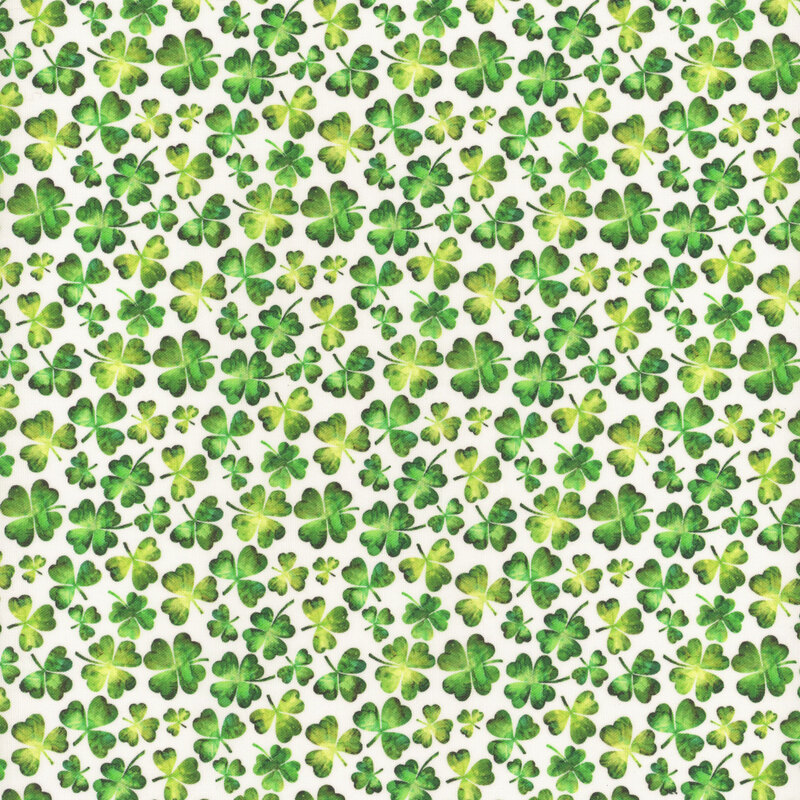 A repeated pattern of small green clover on a white fabric.