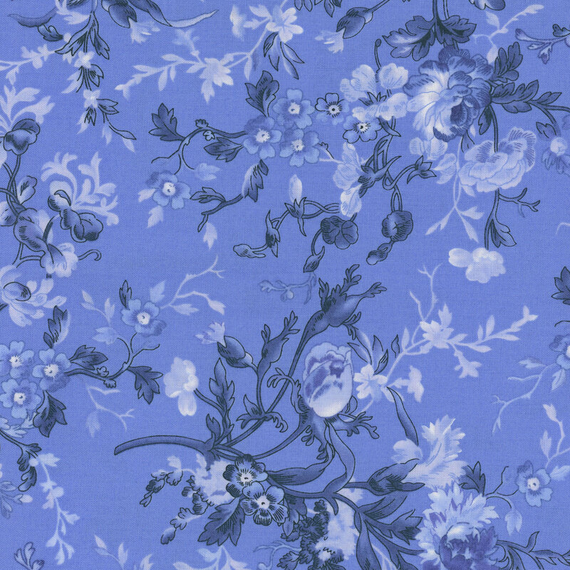 Blue fabric with sprawling blue florals.