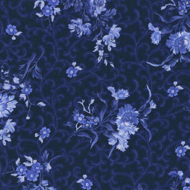 Dark navy fabric with blue florals and curling ornamental accents.