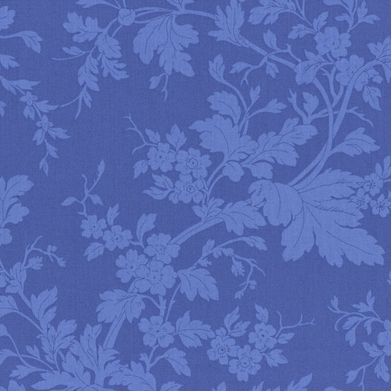 Ultramarine blue fabric with tonal sprawling leaves.
