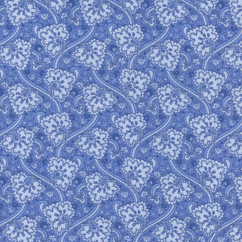Cobalt blue fabric with stylized florals and swirling vines on a textured background.