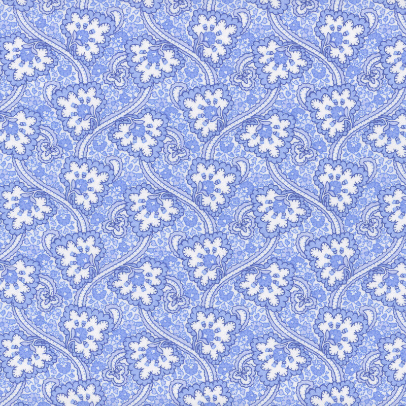 Light blue fabric with stylized white florals and swirling vines on a textured background.